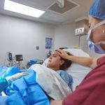 Women in childbirth looking scared
